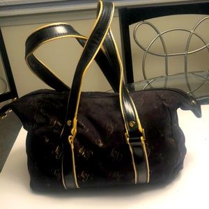 Baby phat vintage purse with suede body and leather handles with gold trim.